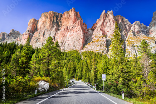 Dolomites, Italy. Sella Ronda mountain ridge and winding road to Sella Pass