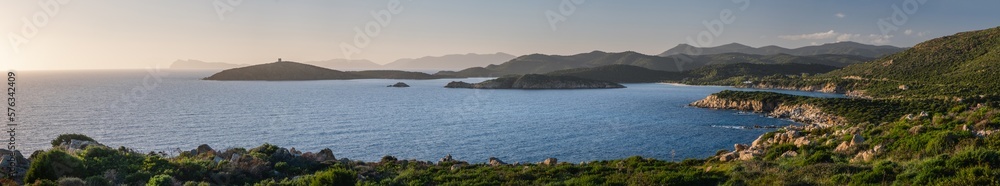 Panoramic view of Mediterranean Sea shore, Capo Malfatano, Island Isola di Tueredda, Tuelada, South Sardinia. Seascape at sunset, Italy.