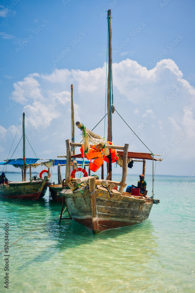 Board a traditional wooden dhow boat and discover the natural wonders of Zanzibar's Blue Safari, from coral reefs to deserted islands.