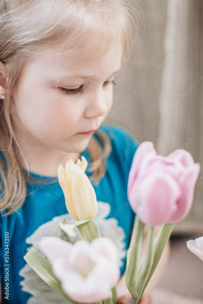 portrait of a girl with flowers tulips