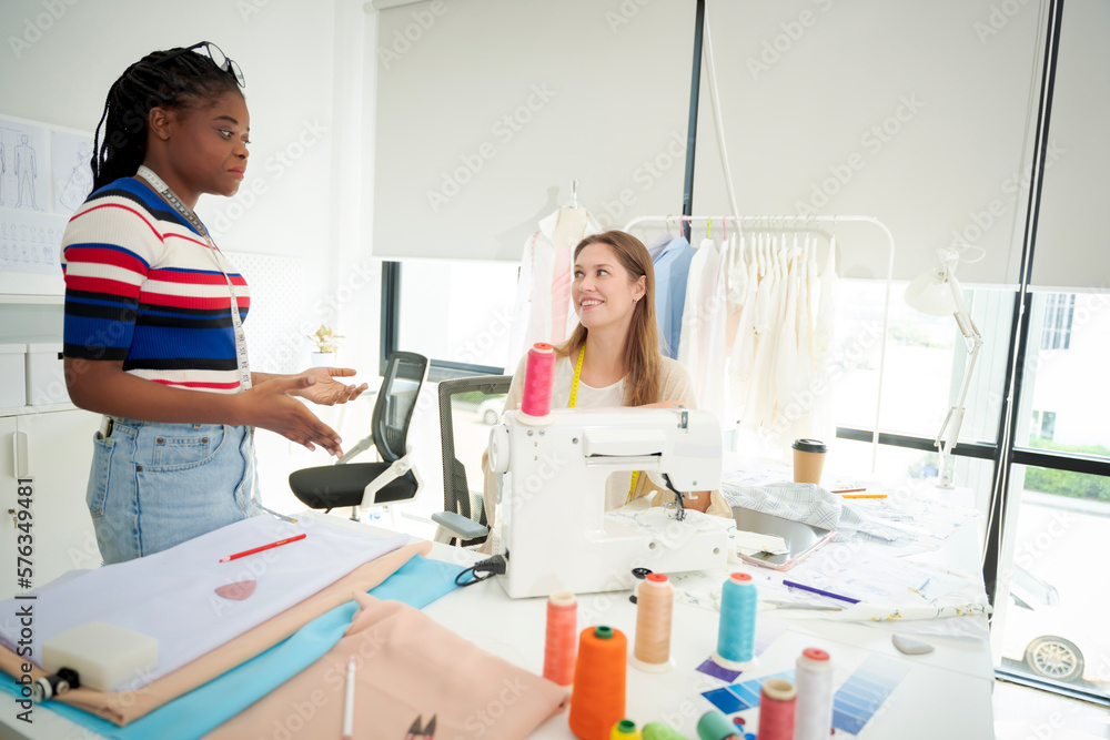 Women working together Small business, SME, tailoring designs for customers. Both of them acted as great designers. Women working together Small business, SME, tailoring designs for customers. Both of them acted as great designers.
