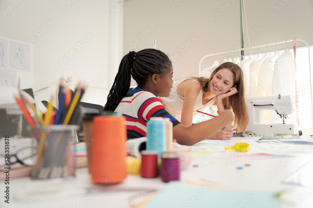 Women working together Small business, SME, tailoring designs for customers. Both of them acted as great designers. Women working together Small business, SME, tailoring designs for customers. Both of them acted as great designers.