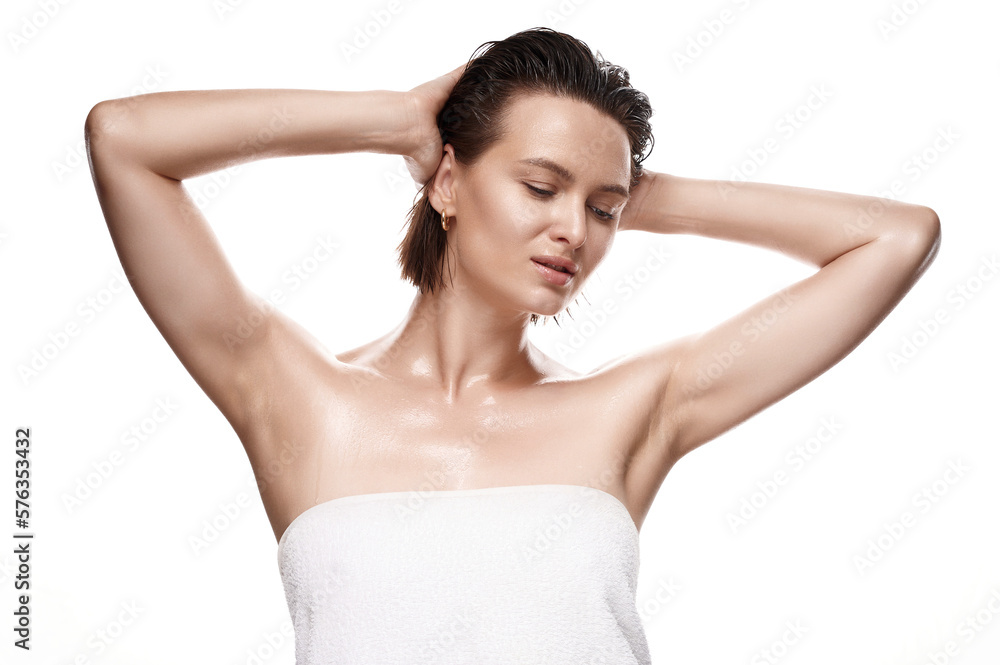 A captivating woman with glowing, dewy skin and wet locks, shrouded in a towel against a pure, unblemished white background. A breathtaking image of natural beauty and flawless skincare A captivating woman with glowing, dewy skin and wet locks, shrouded in a towel against a pure, unblemished white background. A breathtaking image of natural beauty and flawless skincare