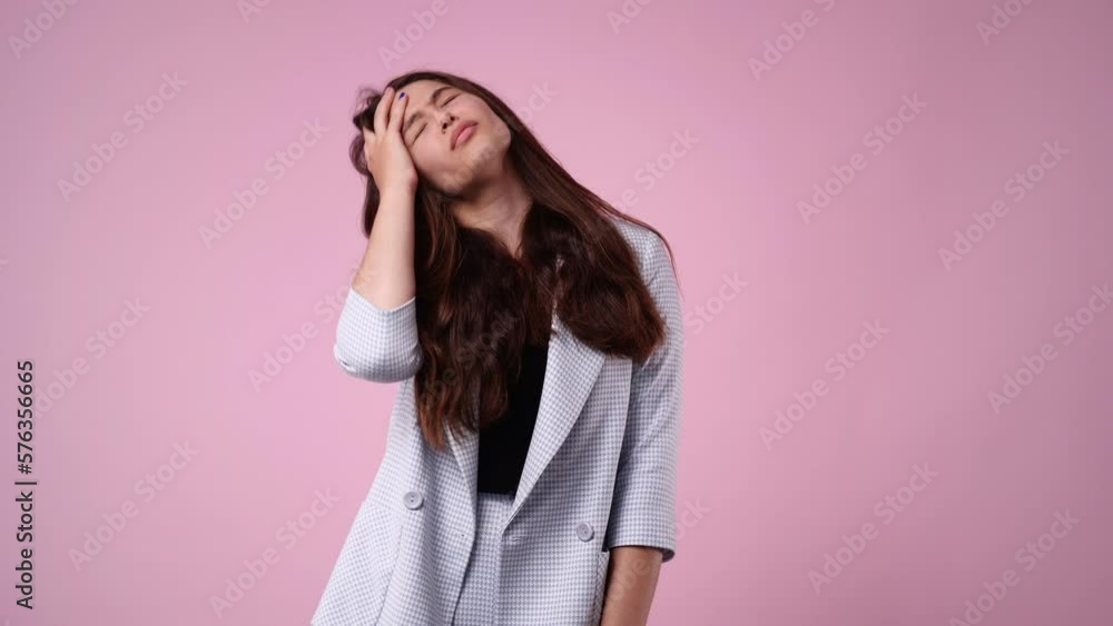 4k video of one girl with negative facial expression over pink background. 4k video of one girl with negative facial expression over pink background.