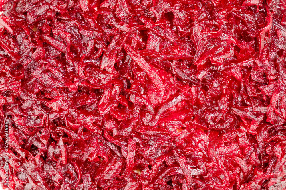Fototapeta premium Vegetable background with close up of boiled grated beets. Vegan and vegetarian background