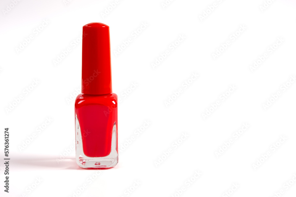 Red nail polish bottle isolated on white background. Copy space, place for text Red nail polish bottle isolated on white background. Copy space, place for text