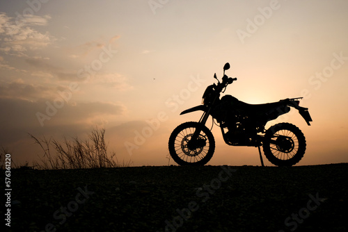 silhouette of a bike. silhouette of a motorcycle. motorcycle on sunset.  Silhouette Motocross Motorcycle