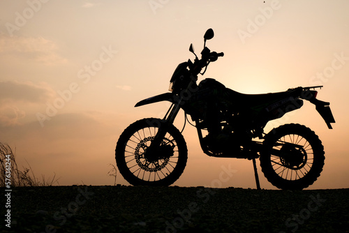 silhouette of a bike. silhouette of a motorcycle. motorcycle on sunset.  Silhouette Motocross Motorcycle