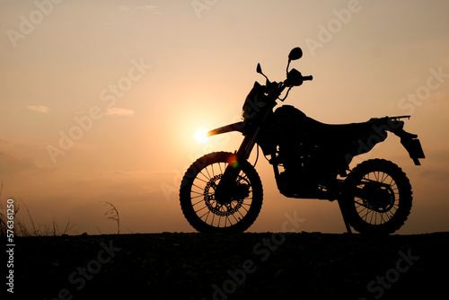 silhouette of a bike. silhouette of a motorcycle. motorcycle on sunset. Silhouette Motocross Motorcycle © STOCK PHOTO 4 U