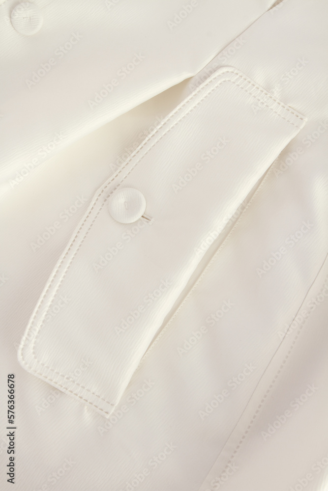 detail of white shirt with pocket and button detail of white shirt with pocket and button