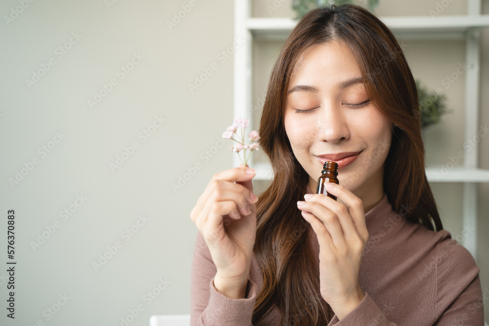 close-up view person test smelling aroma essential oil in the bottle for diffuser close-up view person test smelling aroma essential oil in the bottle for diffuser