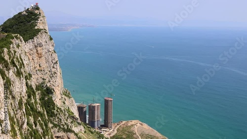 Footage at the top of the the famous Rock of Gibraltar This famous limestone promontory features a nature reserve, a network of tunnels and sea views showing a construction site on an apartment block