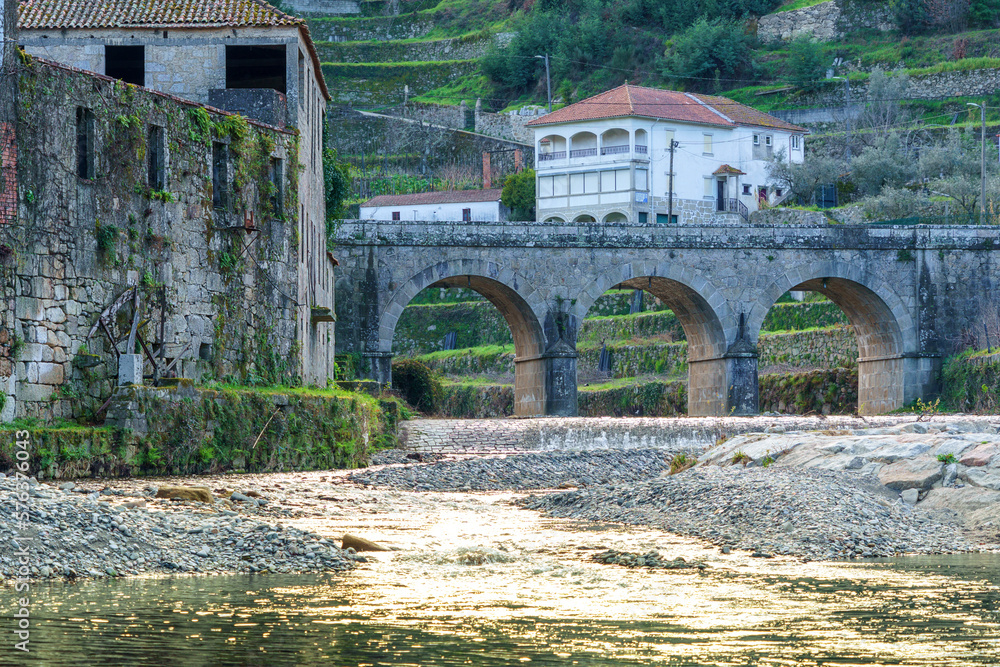 old river valley stone bridge over waterway