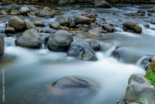 River water flow photographed with long exposure technique so it looks smooth like silk