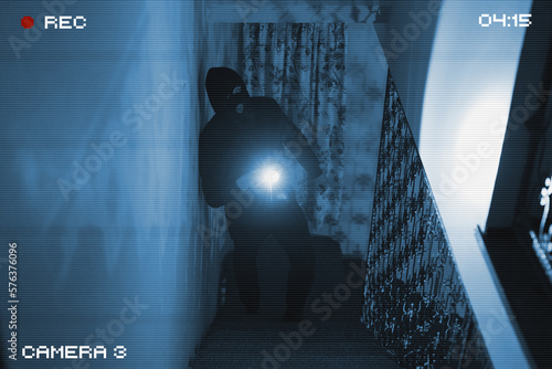 The thief breaks into the house. View through a security camera. Fototapet