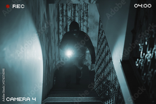 Photos The thief breaks into the house. View through a security camera.
