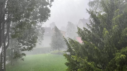 Footage of extreme weather with rain and wind in summer
