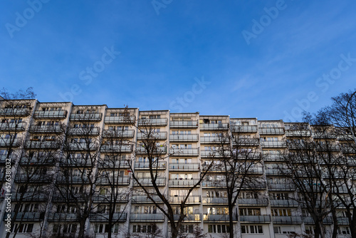 Facade with balconies in an apartment block. Multi-family housing, the object against the blue sky.