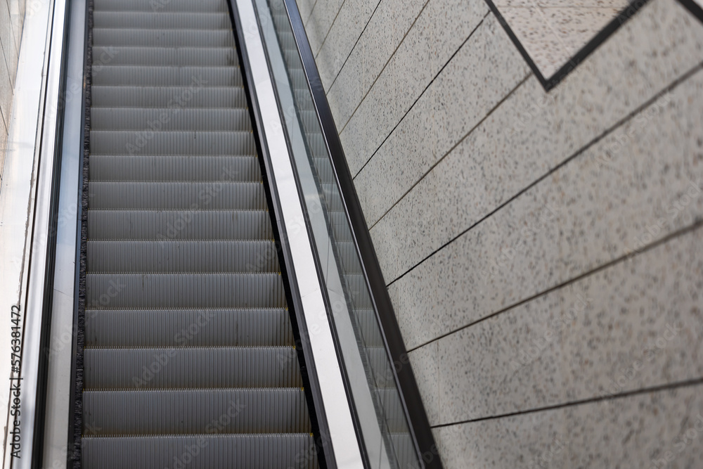 Obraz premium Escalators in an underground pedestrian passage. Underground urban infrastructure for pedestrian traffic