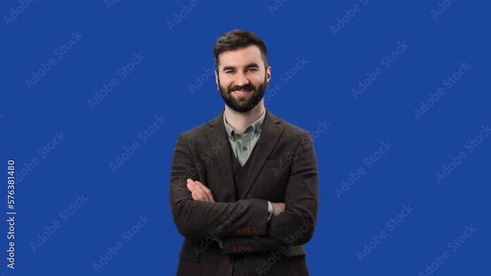 Portrait smiling brutal successful male boss fashion suit posing isolated on blue screen chroma key