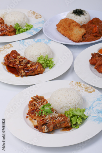 set of various plates of food, deep-fried chicken, and deep-fried pork isolated on white background, top view.