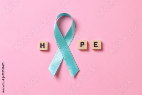Teal awareness ribbon arrange hope word for Ovarian Cancer month, cervical cancer, Polycystic Ovary Syndrome (PCOS) disease, Post Traumatic Stress Disorder (PTSD), Obsessive Compulsive Disorder (OCD) photo
