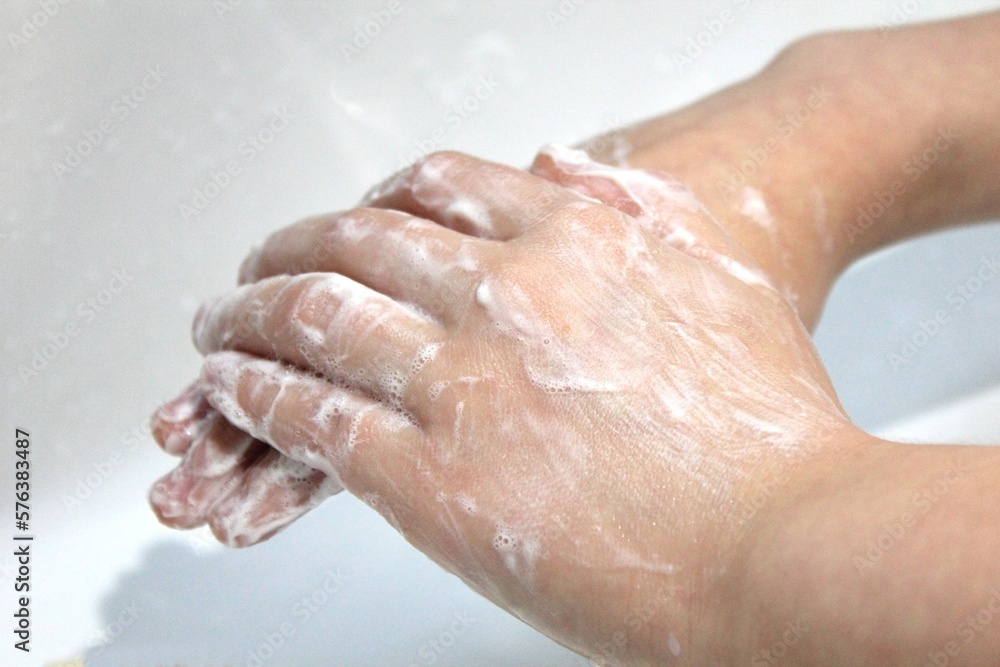 Close-up children's hands in the soap foam Close-up children's hands in the soap foam