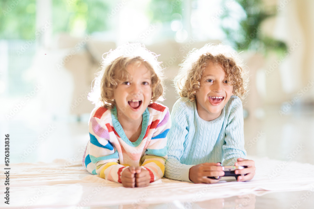 Kids play video game. Children with controller. Kids play video game. Children with controller.
