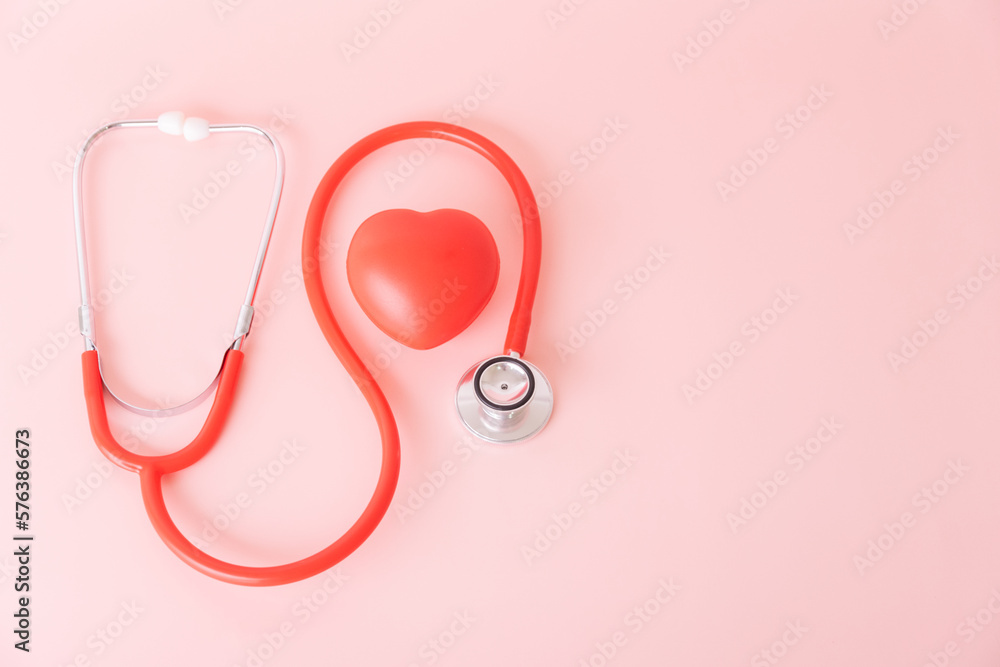 Fototapeta premium Red heart with doctor physician's stethoscope, World heart health day, doctor day.