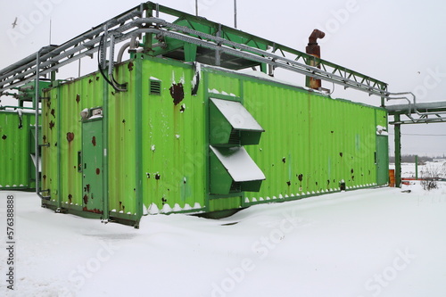 Green containers of gas power plant © Andrey