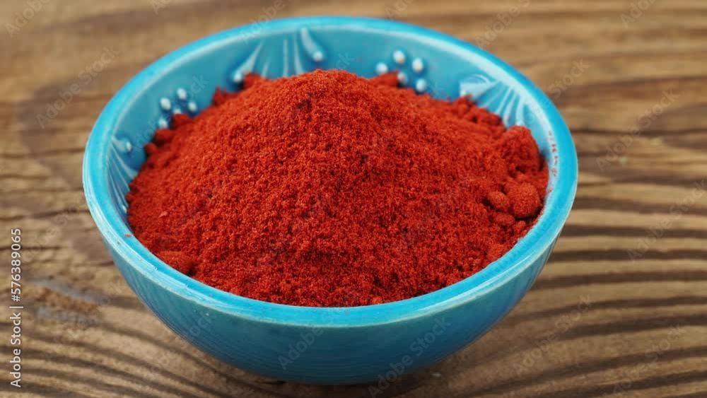 Red ground paprika spice in bowl Red ground paprika spice in bowl