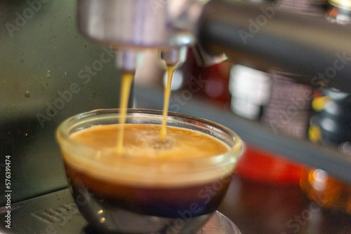 espresso machine pouring coffee focus view closeup