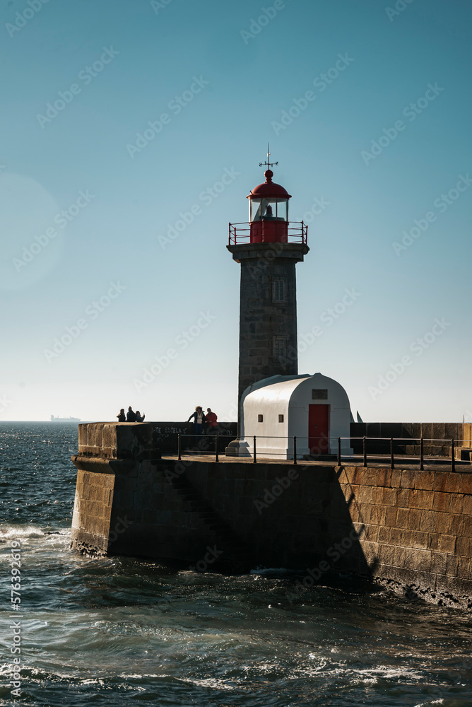 Vertical view of the sunset at the Felgueira lighthouse at the mouth of the Douro. Porto, Portugal