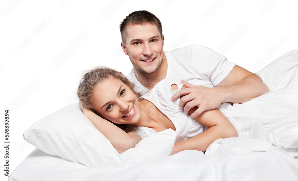 Young couple in bed isolated on white background Young couple in bed isolated on white background