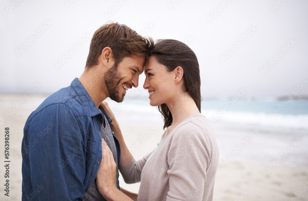 Nature brings out that natural kind of love. Cropped shot of a romantic young couple at the beach. Nature brings out that natural kind of love. Cropped shot of a romantic young couple at the beach.