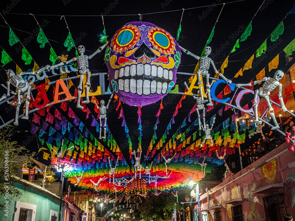 Skeletons flying in the air against the background of colorful ornaments Skeletons flying in the air against the background of colorful ornaments