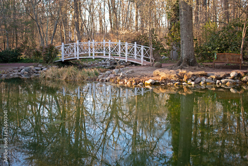 Scenic view of a small bridge crossing over a pond in Sayen Gardens, Hamilton, New Jersey, USA, on a bright, winter day -06