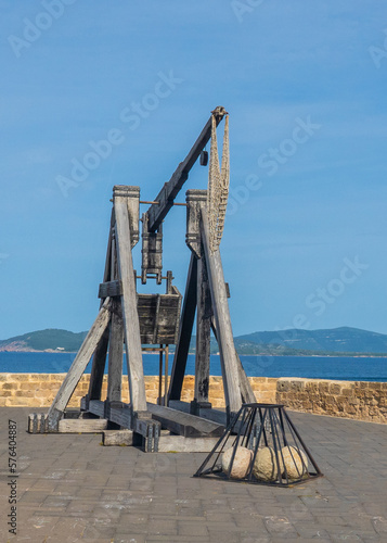 Ancient cannon in front of the sea of ​​the ramparts of Alghero, north Sardinia 