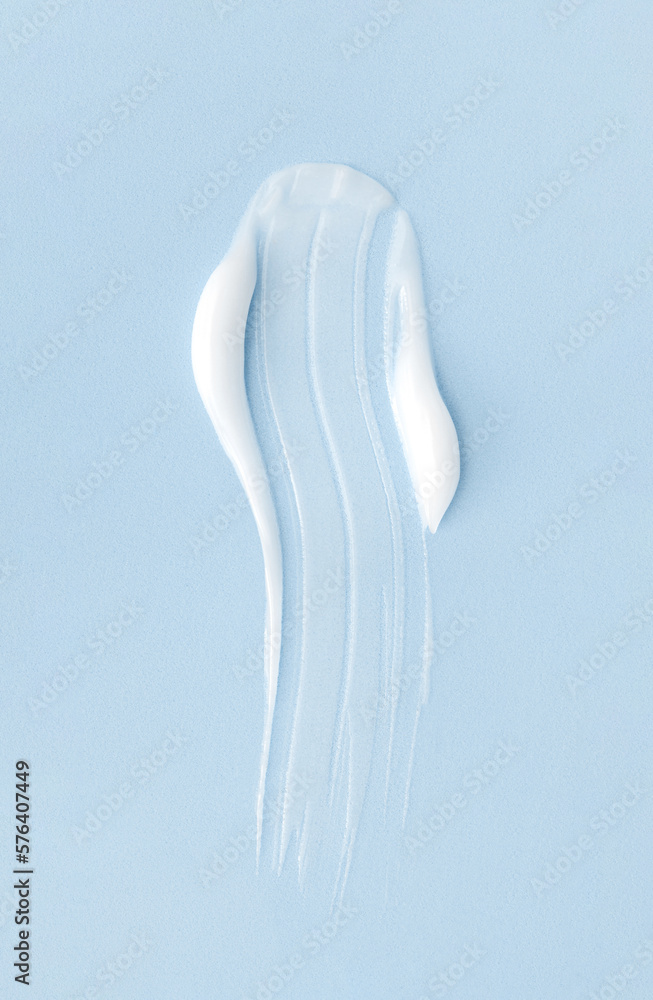 cosmetic smears cream texture on blue background cosmetic smears cream texture on blue background