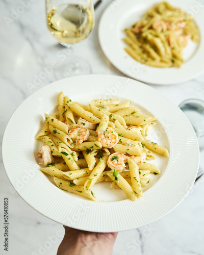 Pasta with shrimps, garlic, lemon and parsley. Penne with shelled shrimps