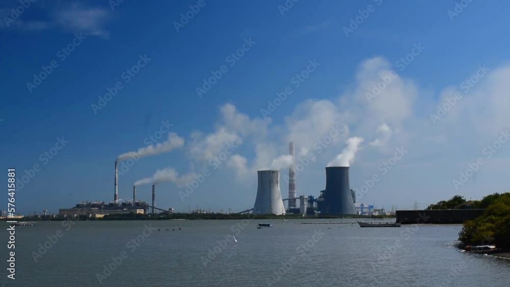Steam billowing from thermal power plant chimney Steam billowing from thermal power plant chimney