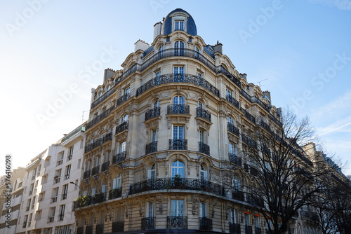 The facade of traditional French house with typical balconies and windows. Paris. © kovalenkovpetr