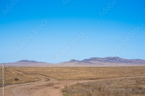 Autumn in the vast plains of the Tibetan Autonomous Prefecture of Haibei  China. Breathtaking  amazing  endless scenery under bright blue sky.