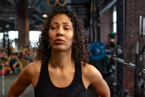 Portrait of a young african american woman relaxing after exercise workout.