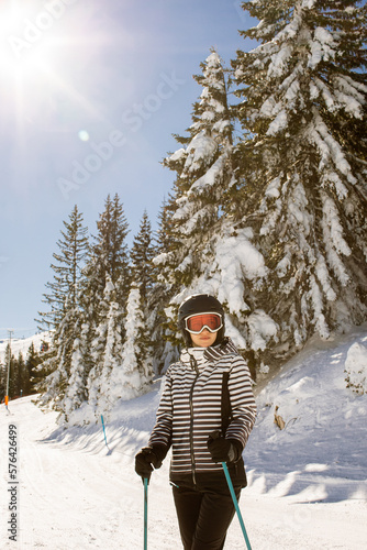 Young woman enjoing winter day of skiing fun in the snow