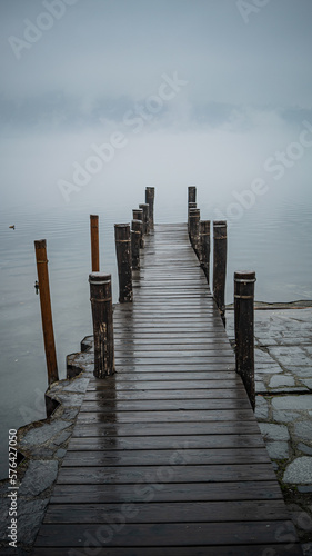 wooden pier in the lake, fog time