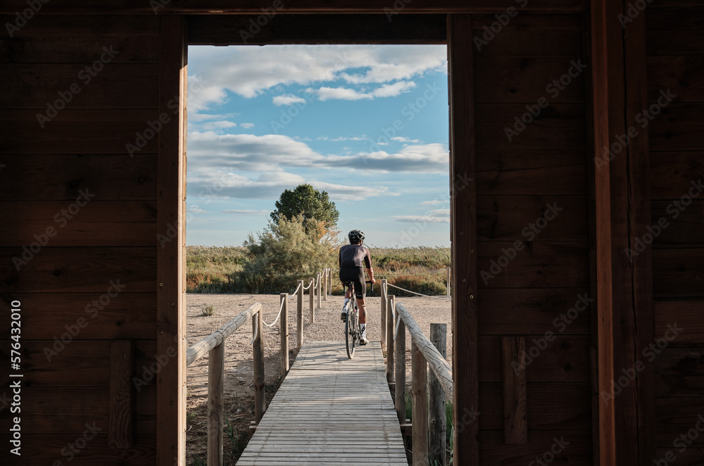 Into the wild: cyclist is ready to tackle any challenge on his gravel bike.
Following the cyclist.Cycling adventure.Elche, Alicante, Spain