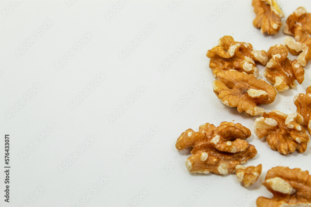 Fototapeta premium Nuts. Walnuts on the side of the image. Wallpaper
