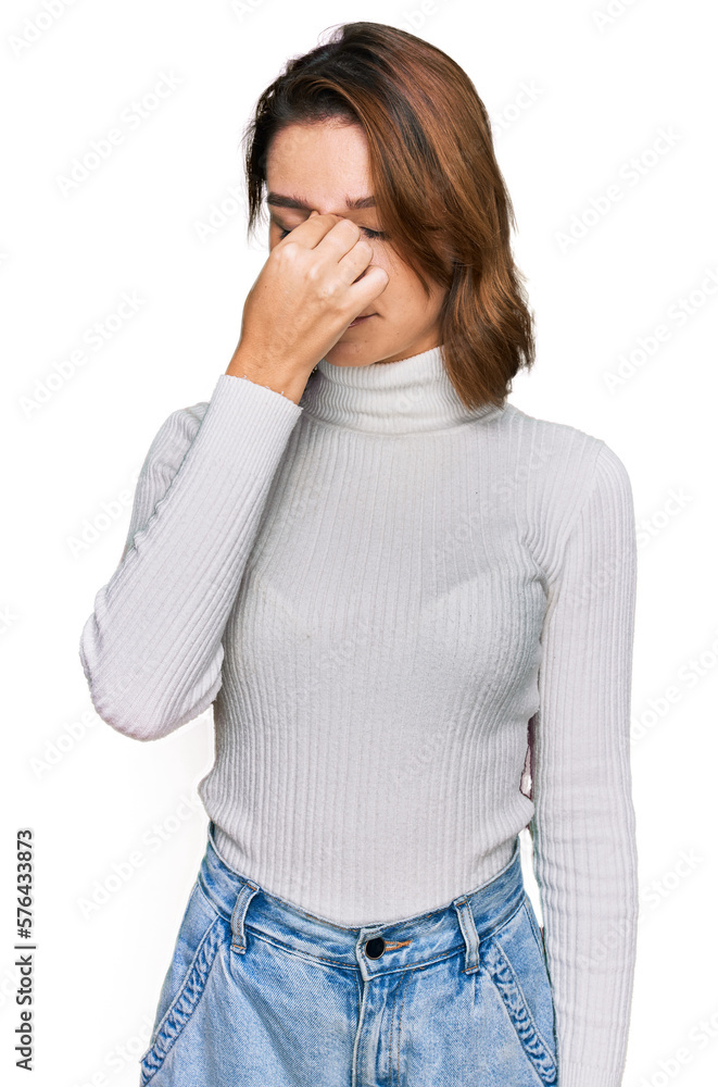 Young caucasian girl wearing casual clothes tired rubbing nose and eyes feeling fatigue and headache. stress and frustration concept. Young caucasian girl wearing casual clothes tired rubbing nose and eyes feeling fatigue and headache. stress and frustration concept.