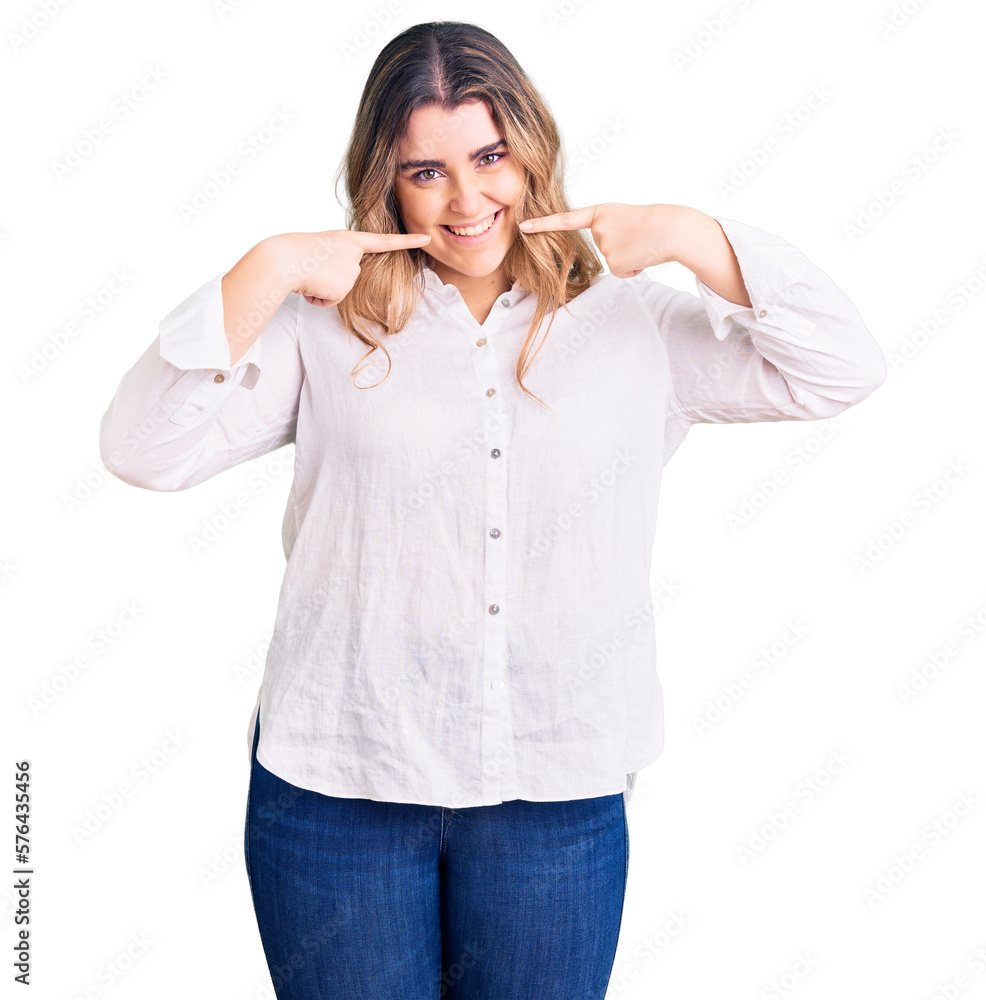 Young caucasian woman wearing casual clothes smiling cheerful showing and pointing with fingers teeth and mouth. dental health concept. Young caucasian woman wearing casual clothes smiling cheerful showing and pointing with fingers teeth and mouth. dental health concept.